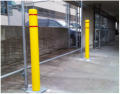 Steel bollard posts with durable and attractive yellow sleeve covers. 