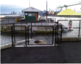 Welded chain link fence and gates powder coated black at a Vancouver marina